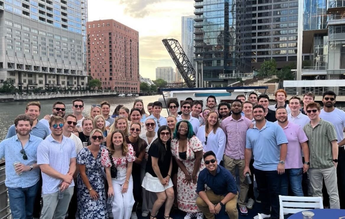 The Energy CX team poses at a waterfront event in Chicago.